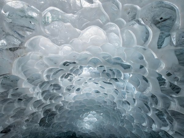Scalloped ablation ripples on the interior wall of a glacier cave in Longyearbreen Svalbard